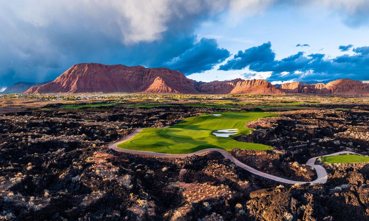 A view of hole one at Black Desert golf course with a view of the mountains surrounding the course
