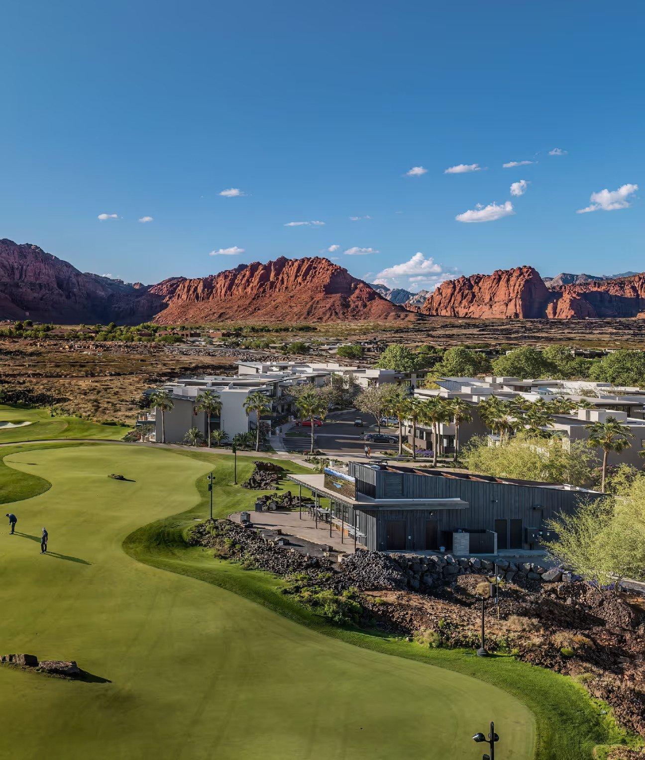 An exterior view of the Yard at Black Desert Resort with te blue sky and mountains in the background