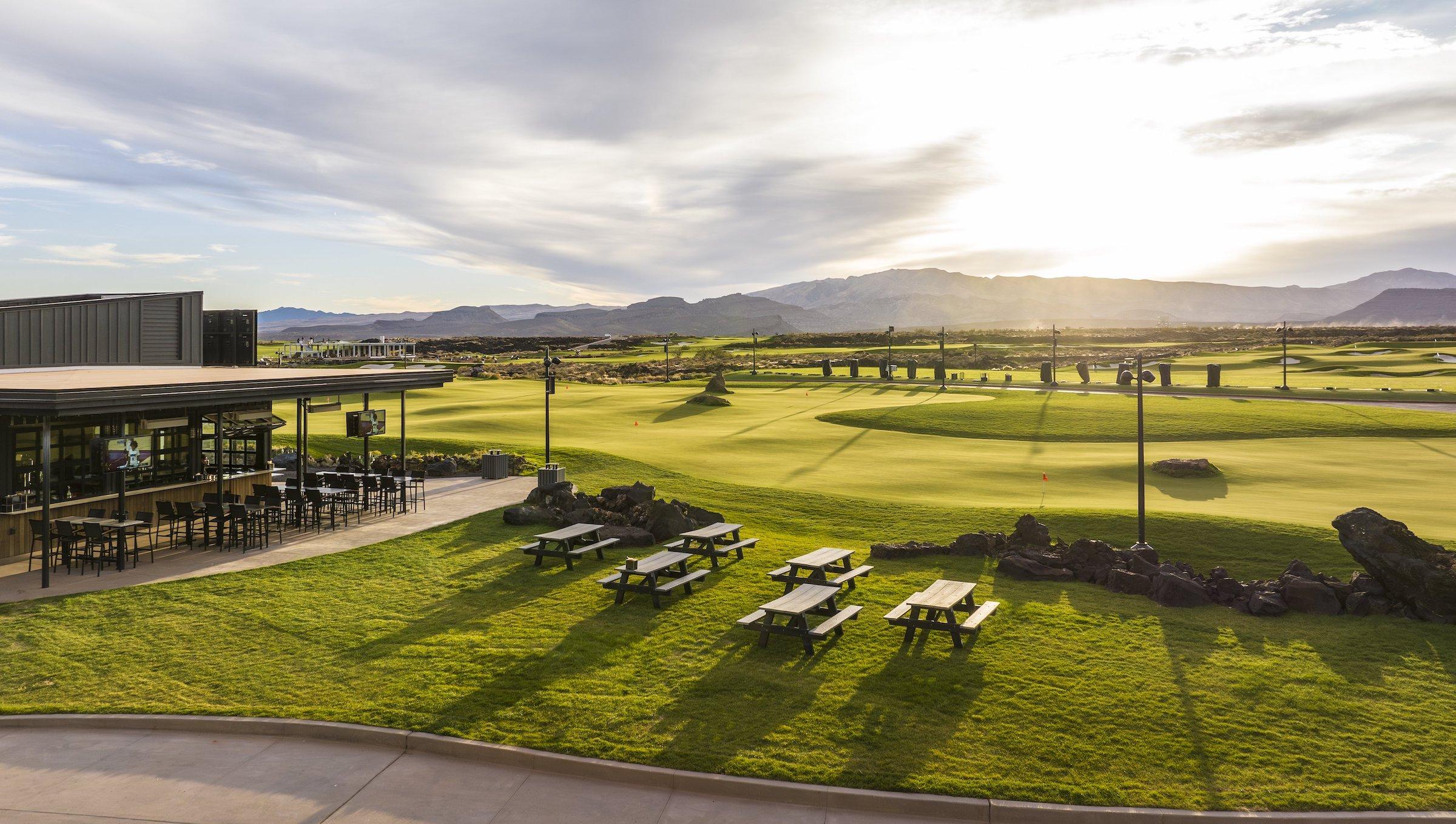Exterior of Club 73 with outside table near the golf course