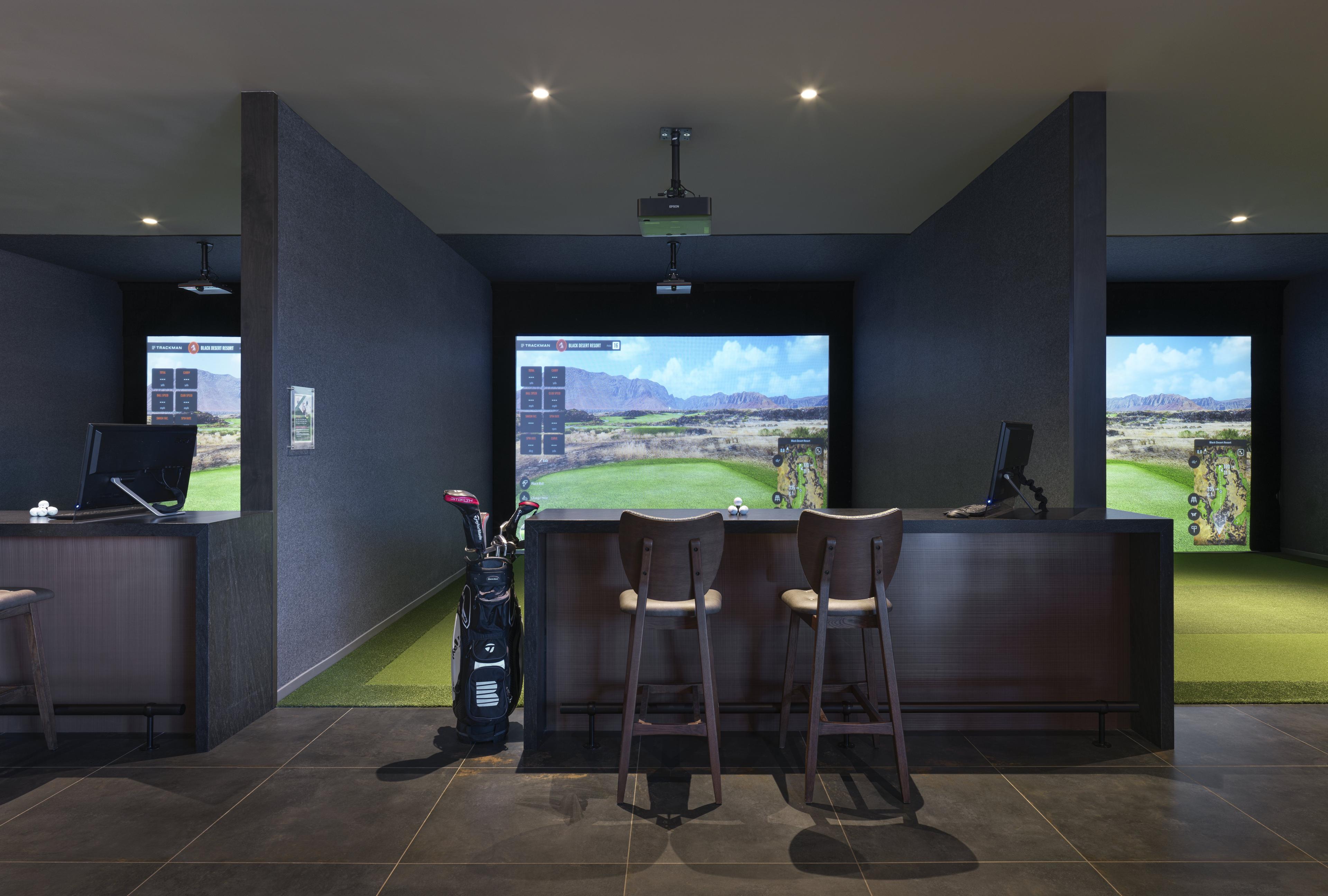 Inside a bar/restaurant with simulated golf stations