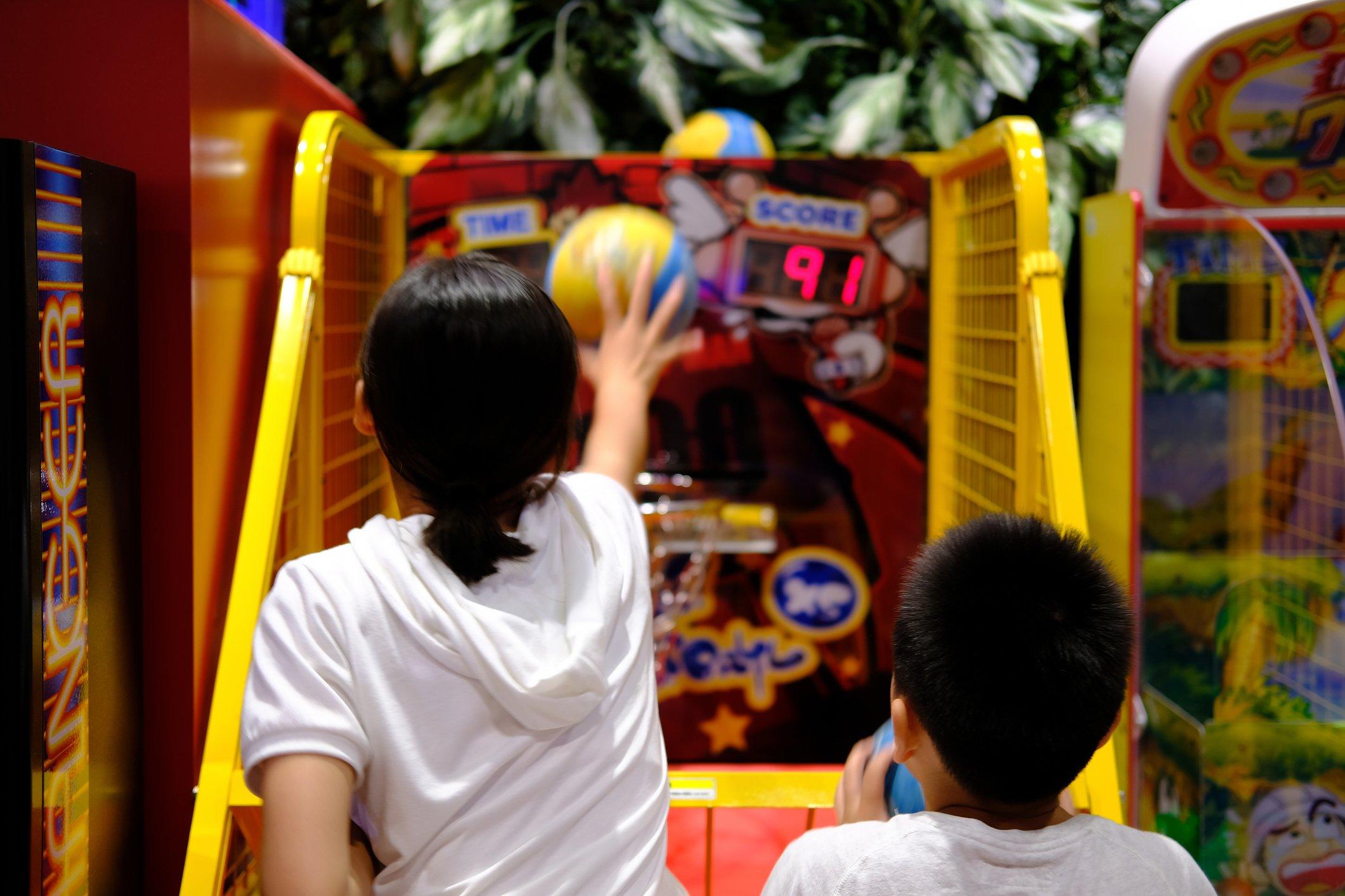 kids playing at arcade