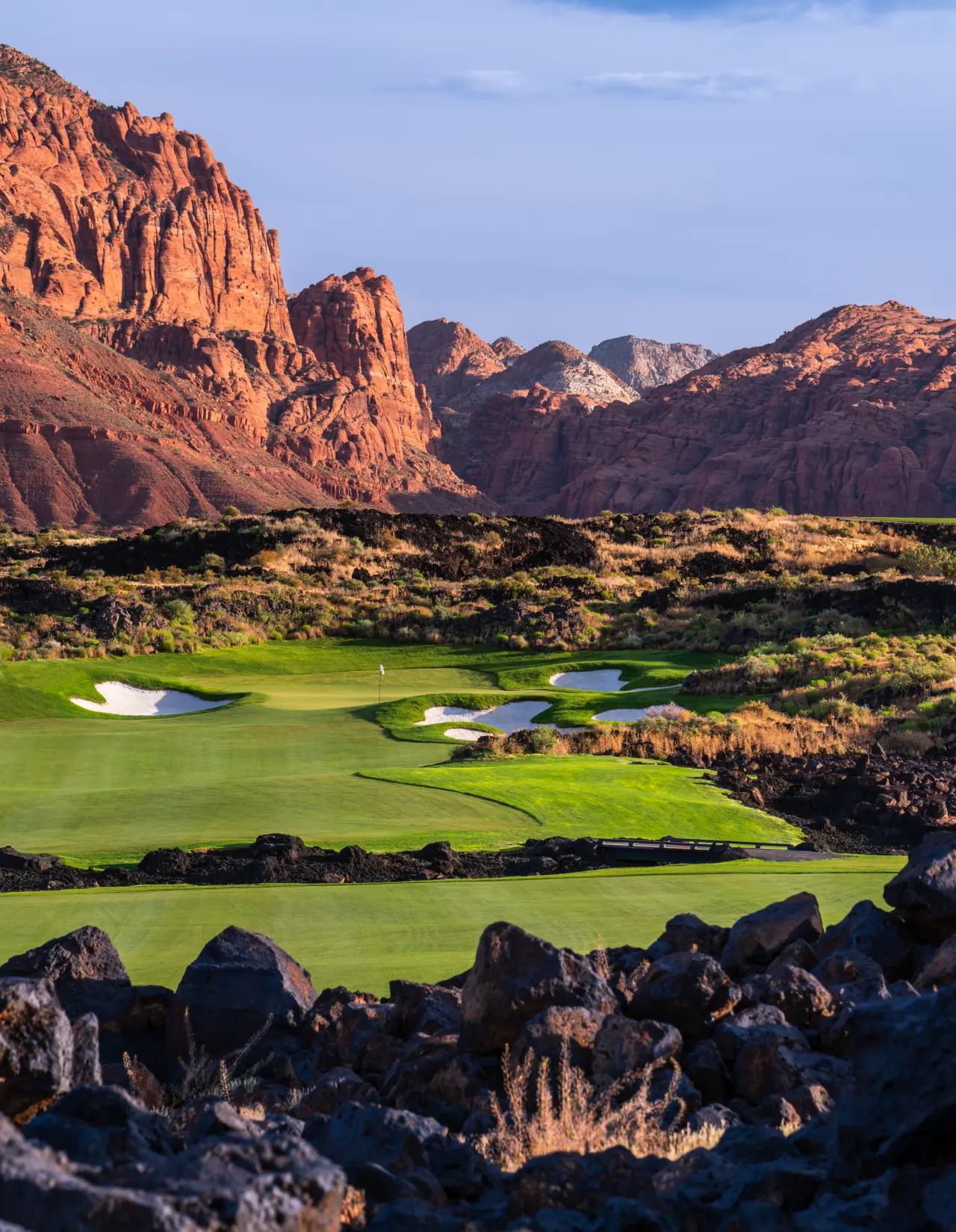 A view of hole 13 at Black Desert golf course with a view of the mountains surrounding the course