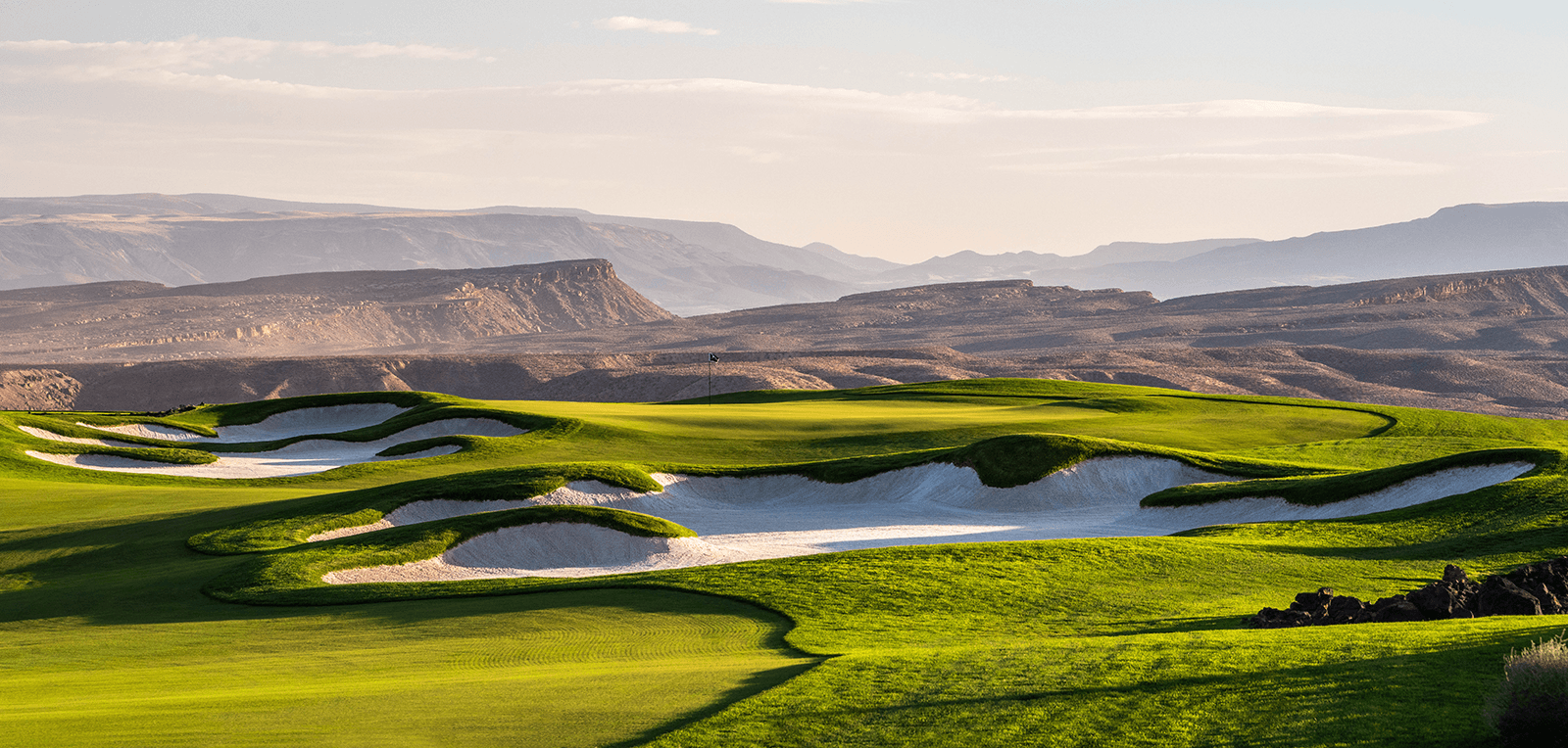 A green with some bunkers at Black Desert Resort