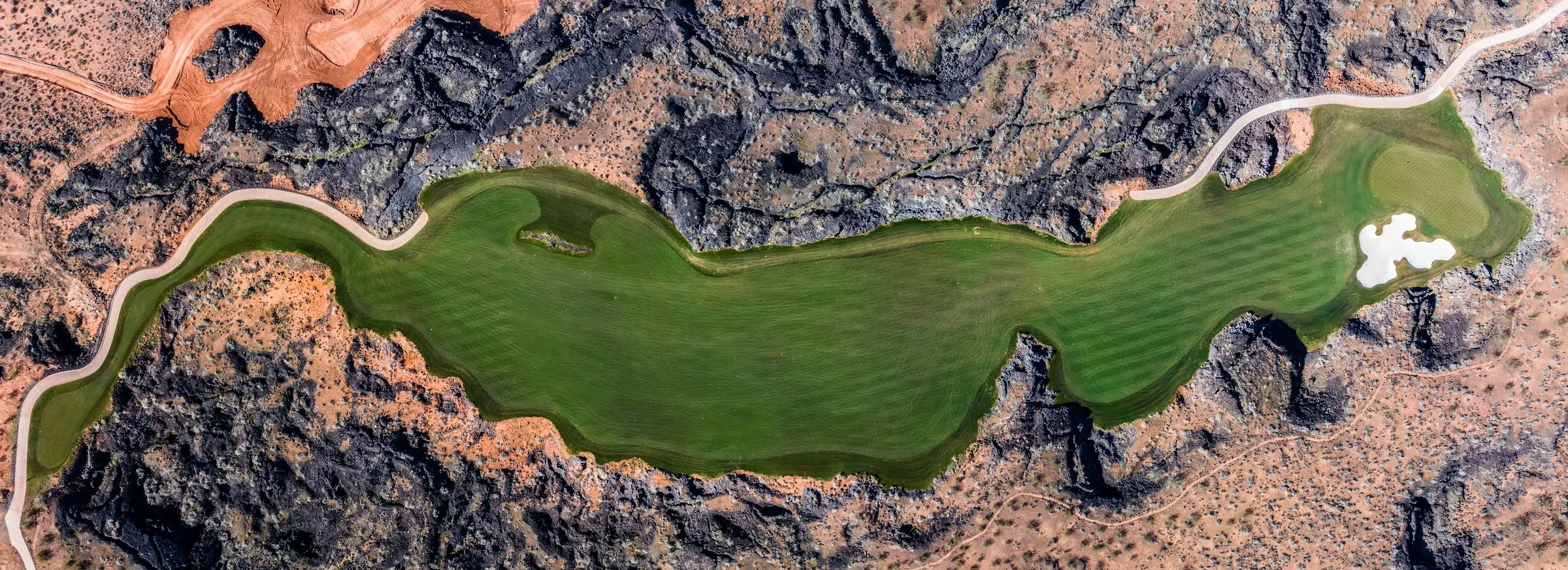 overhead view of a a green and fairway at Black Desert Gold Course