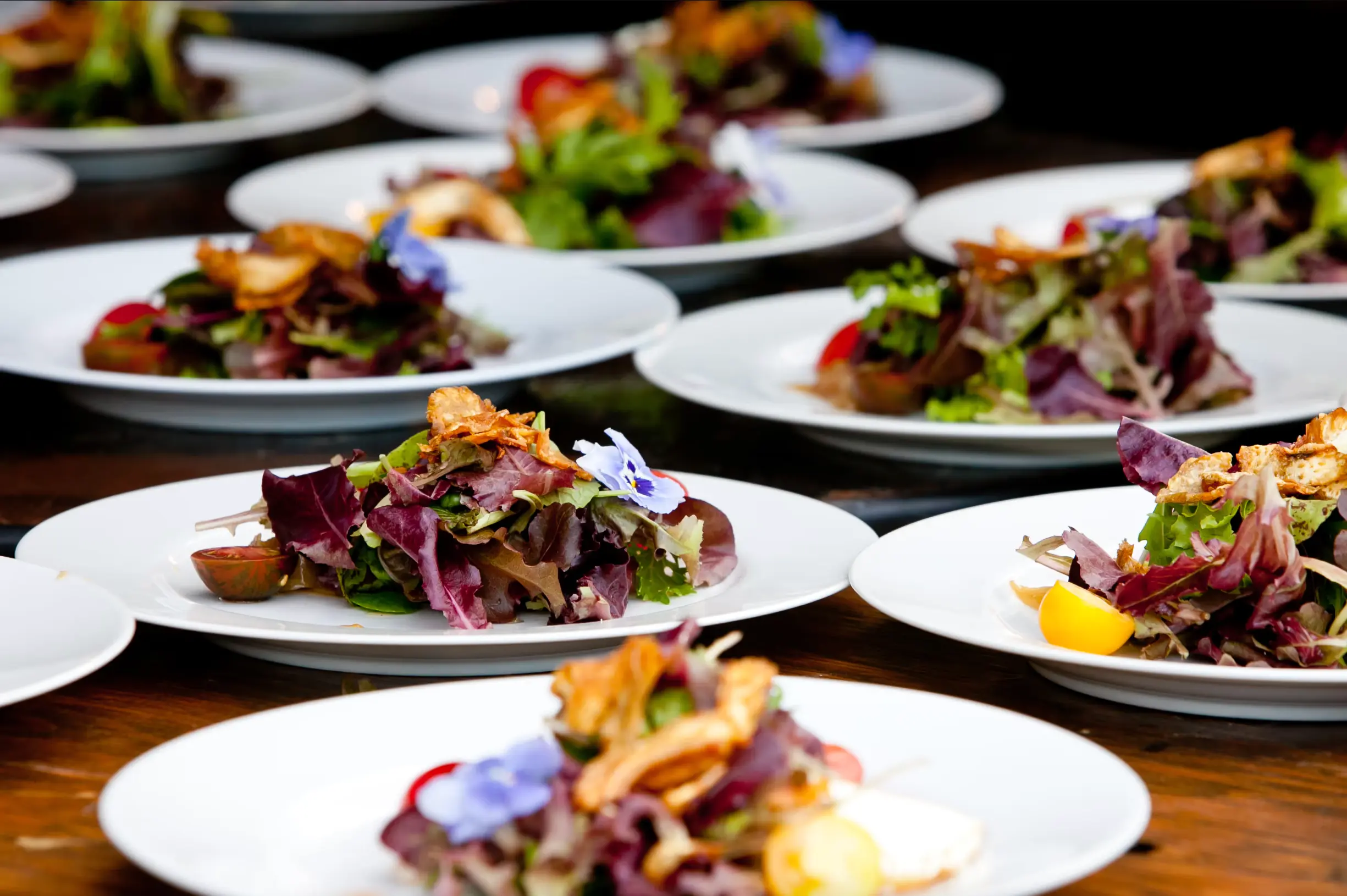 Plates set up to be served at a catering event at Black Desert Resort
