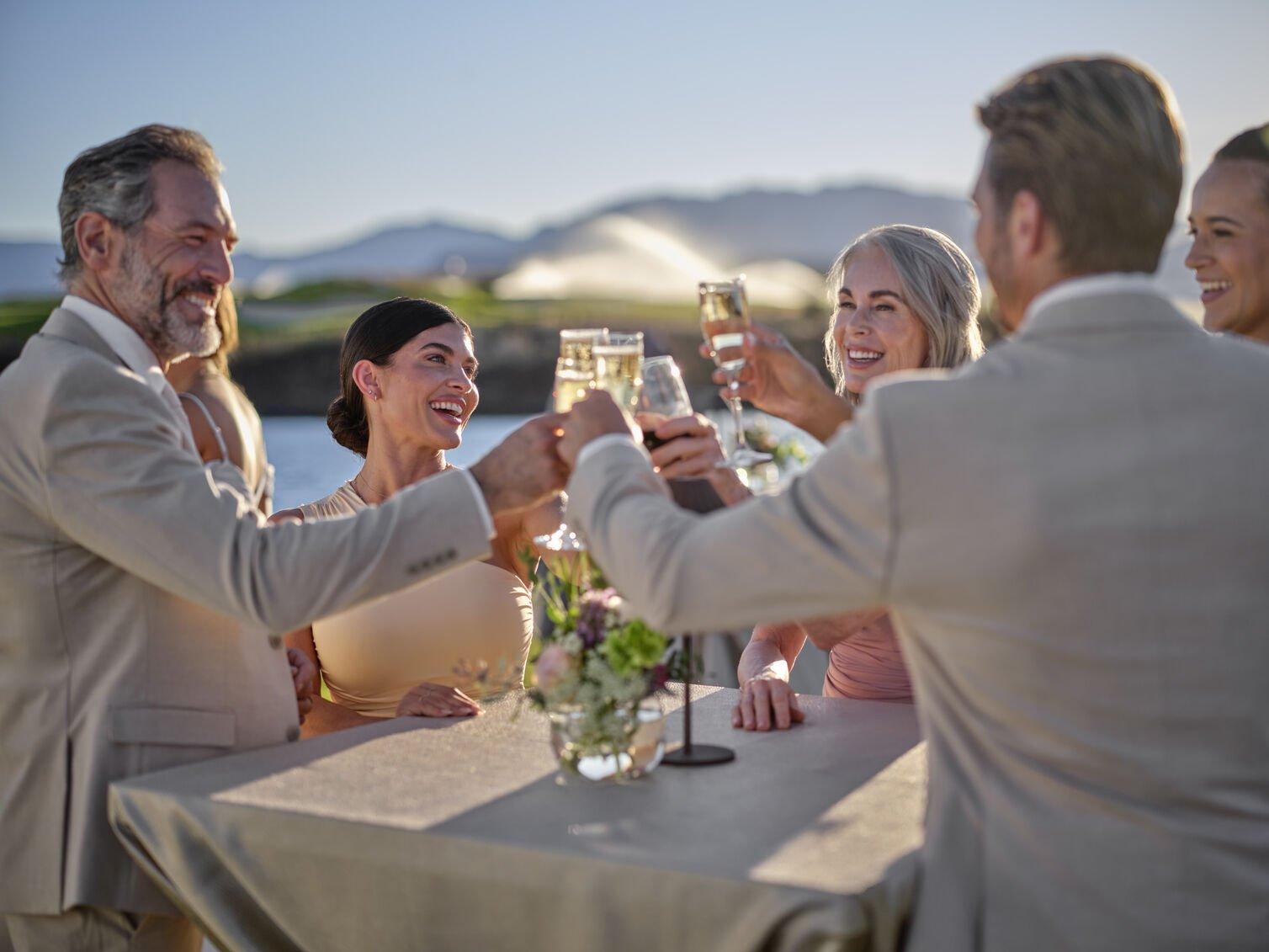 Group gathered around table with drinks