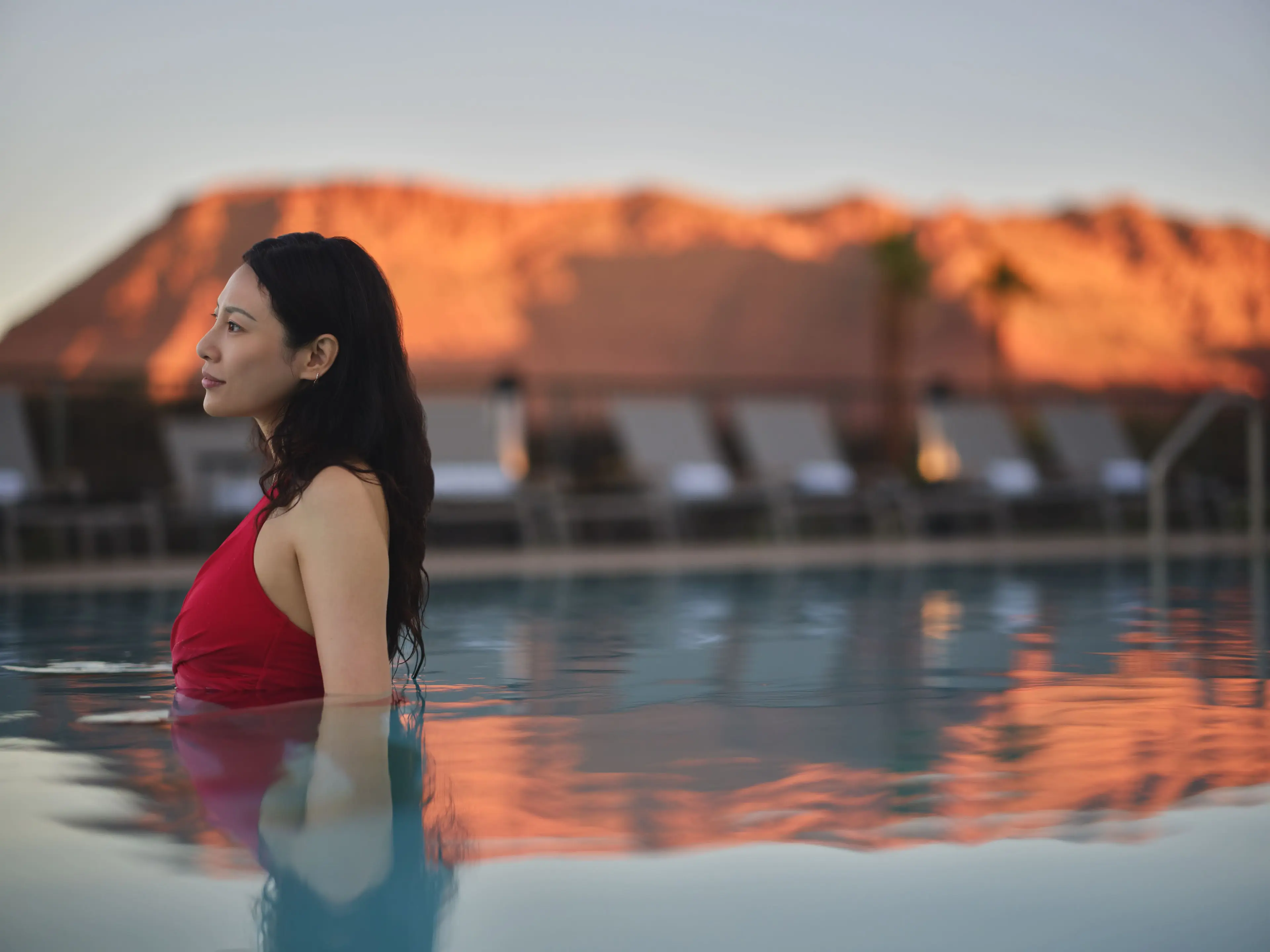 A woman enjoying the pool at Black Desert Resort