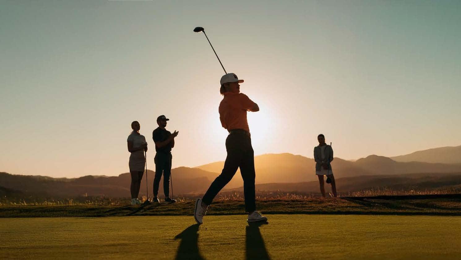 group of golfers at sunset
